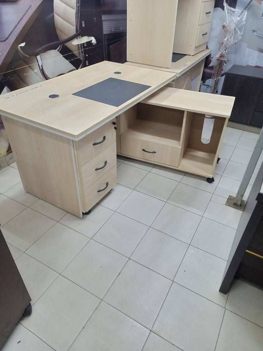 White L-shaped office desk with drawers
