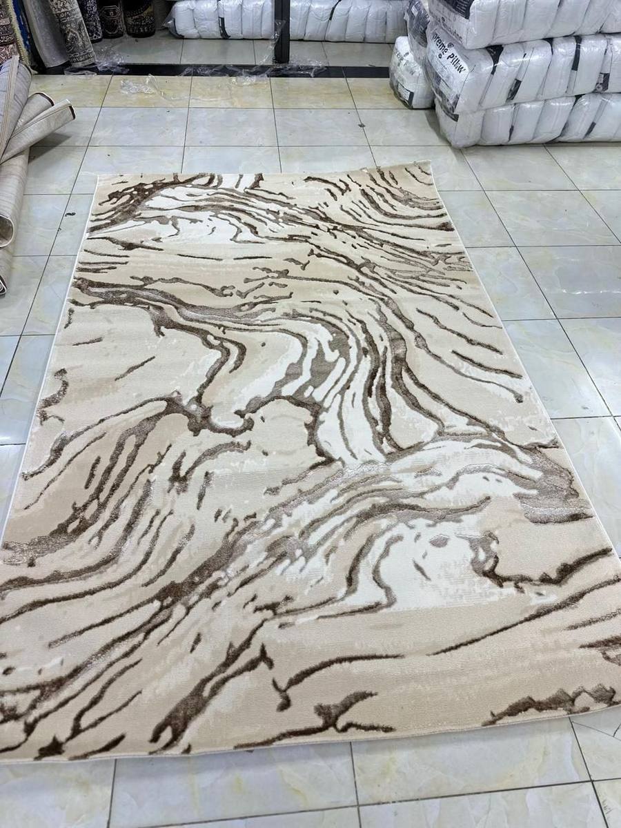 Cream marble-pattern area rug