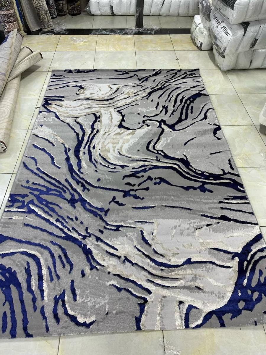 Grey and navy marble-pattern area rug