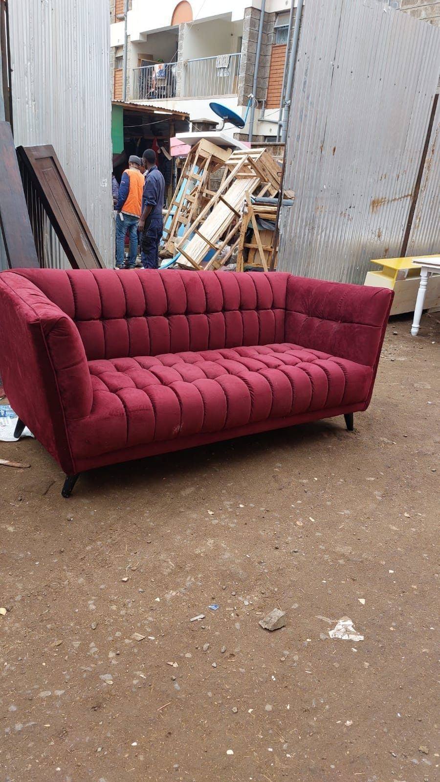 Maroon tufted sofa upholstery